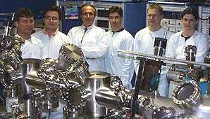 Photovoltaic Group portrait showing MBE apparatus. A. Freundlich 3rd from left.